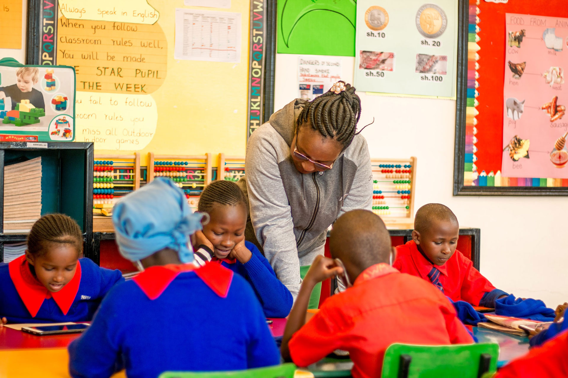 A teacher of English in classroom in a Kenyan school